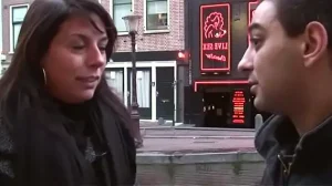 hooker mounts a large pole and rides it vigorously