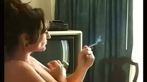 inviting slut in see through raiment smokin a cigarette 1733439144