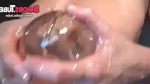 Slut with oiled boobs posing on cam in the bath